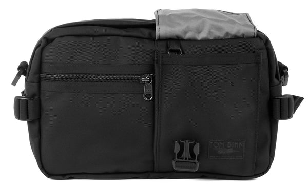 The LGD in Black/Black/Cloud. Front view, front buckle pocket lifted up to show the Cloud lining.